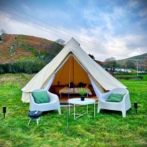 Furnished bell tent on grass