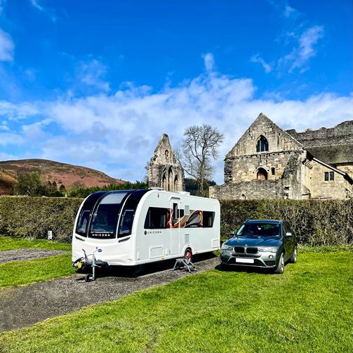 Touring caravan on gravel pitch