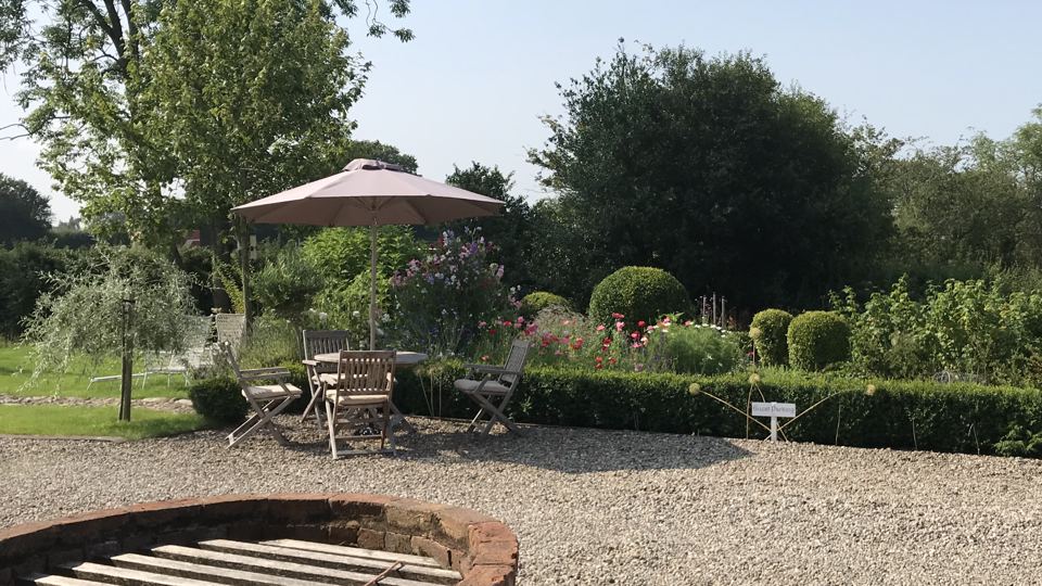 Garden seating by the gravel