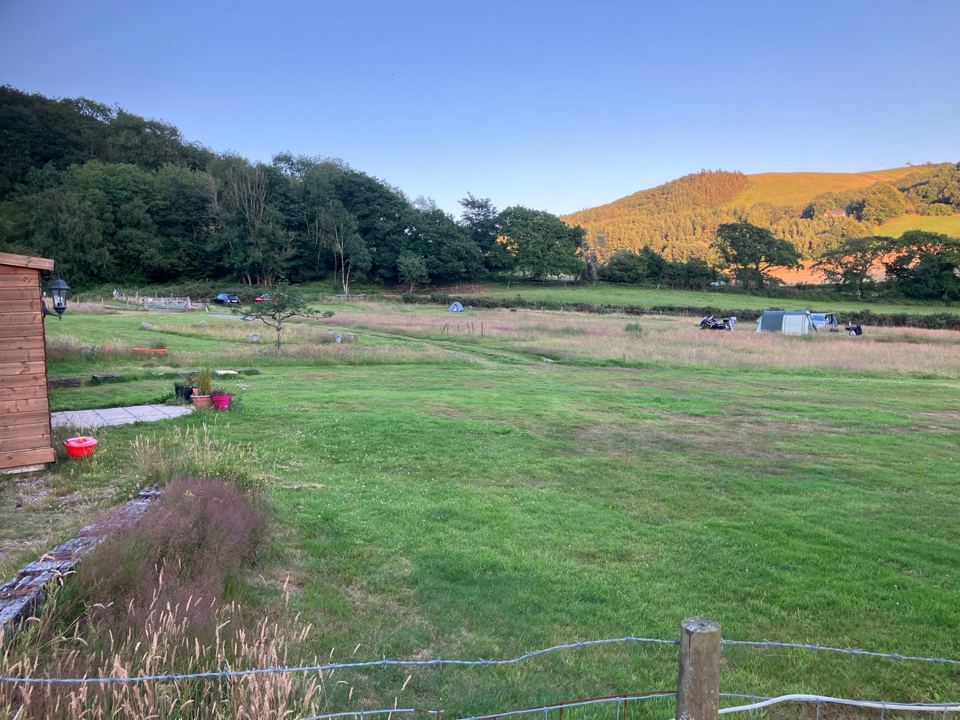 Camping field below the hills