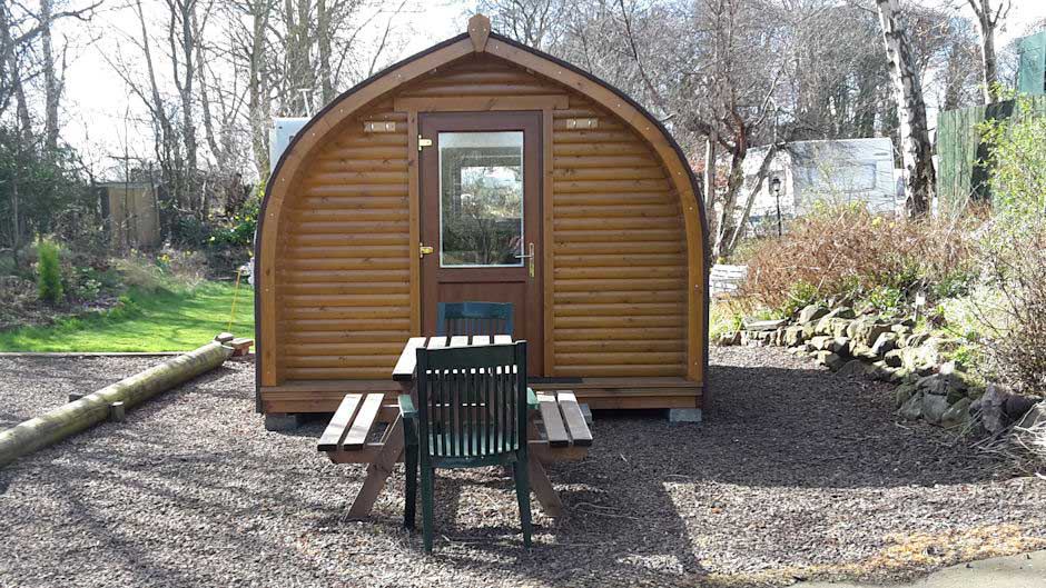 Camping pod and gravel seating area