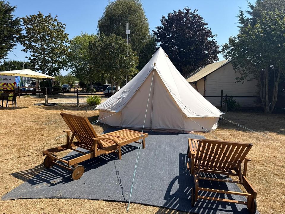 Bell tent with wooden loungers