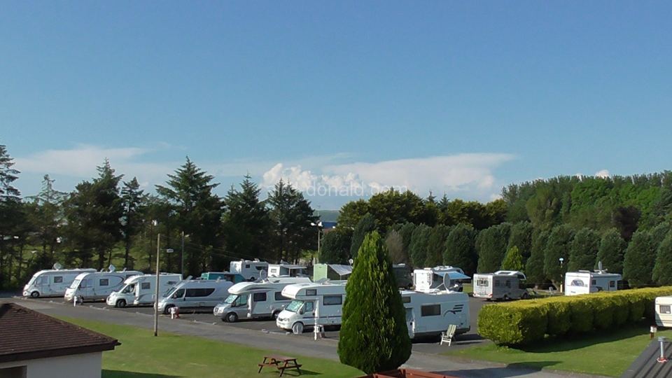 Hardstanding pitches with hills beyond