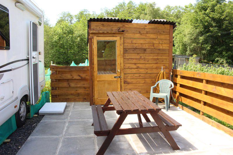 Patio, picnic bench and shed