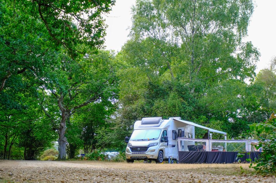 Campervan on a gravel clearing