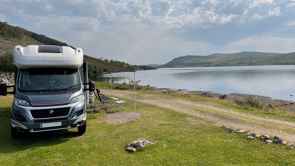 Motorhome pitched by the loch