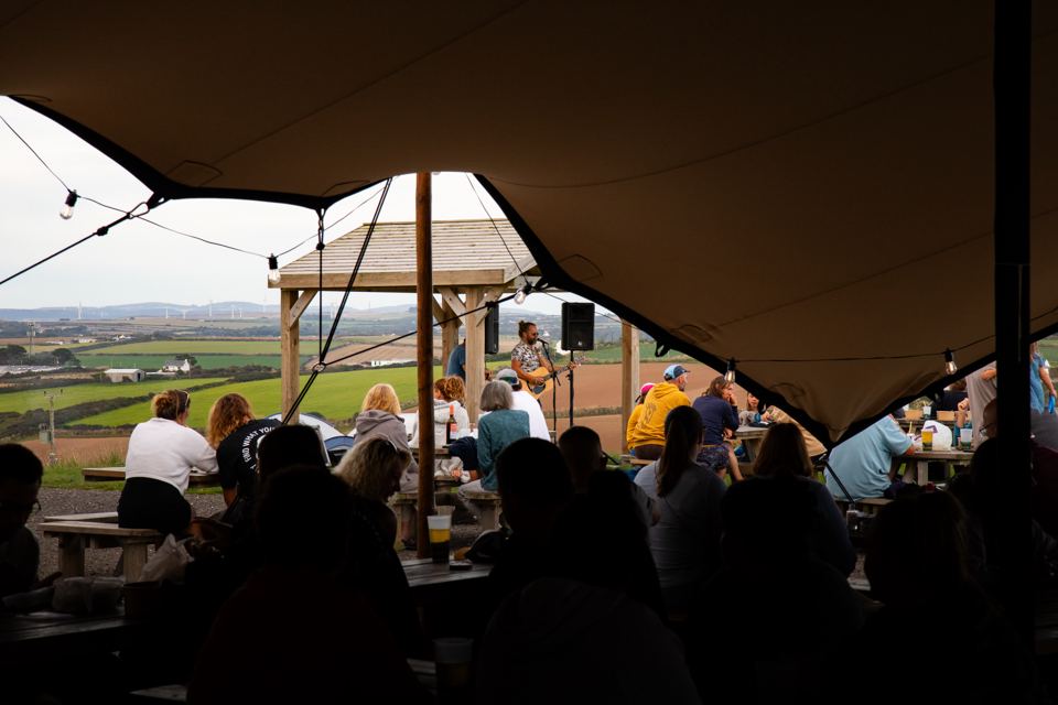 Evening crowd in the bar marquee