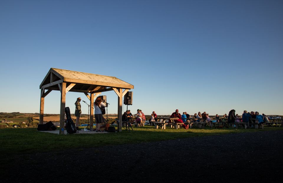 Gazebo and evening crowd on the field
