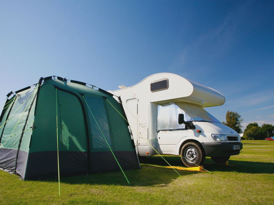 Tent pitched beside a motorhome