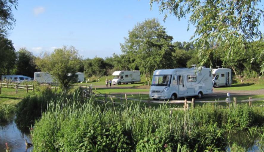 Motorhomes by the stream