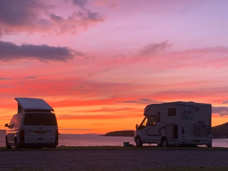 Campervans at sunset