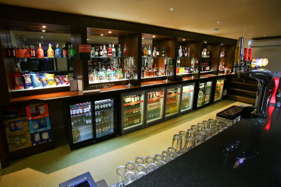 Bar with a full back shelf