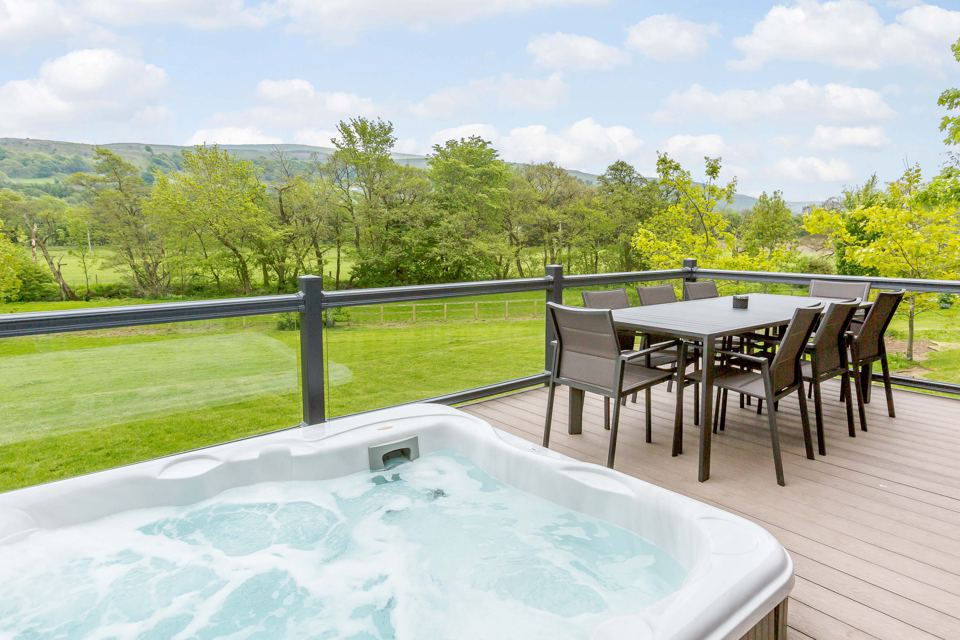 Hot tub and decking with valley view