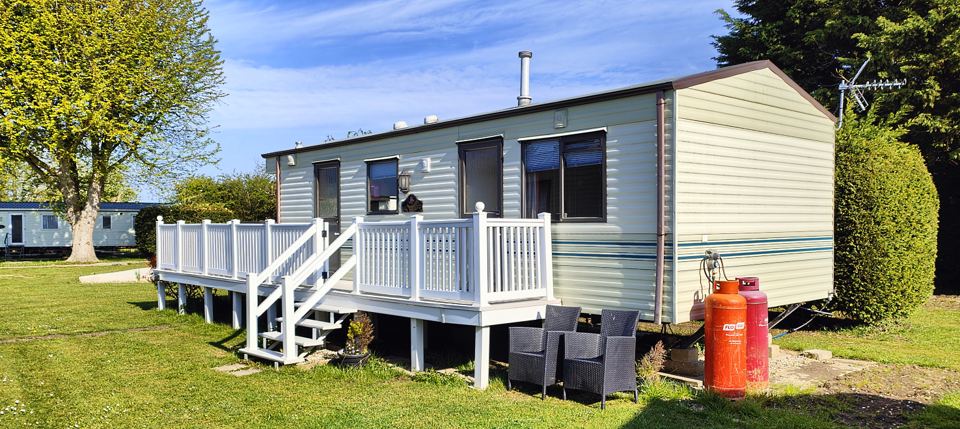 Older caravan with deck