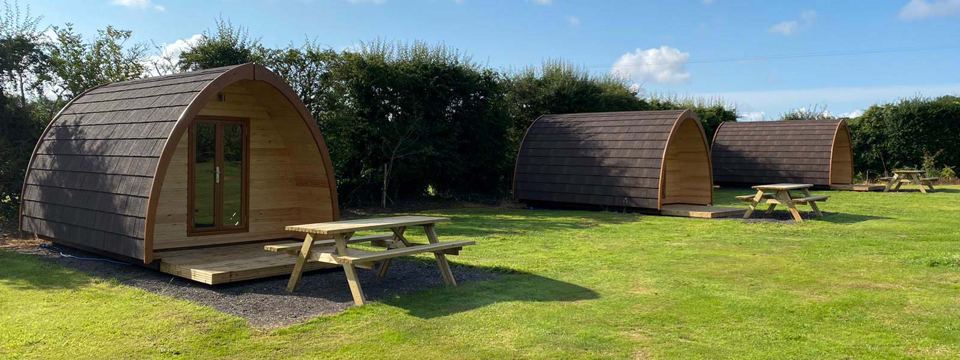 Camping pods on the grass