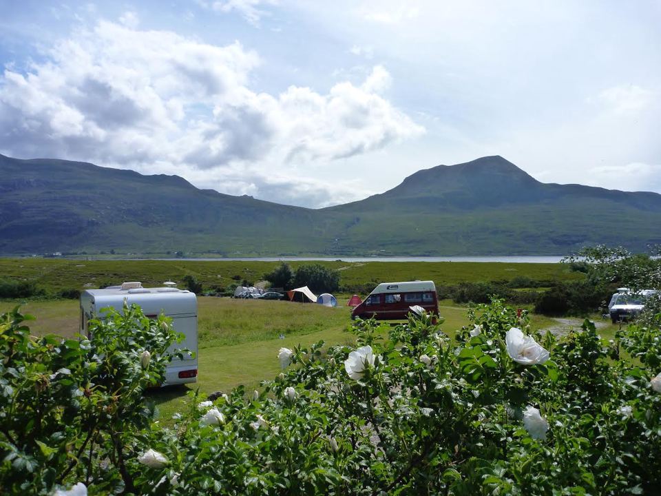 Pitches with hills beyond