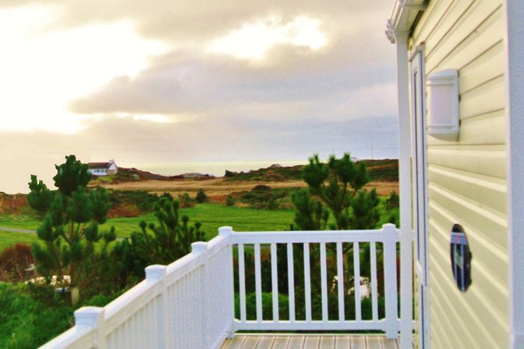 Static caravan deck and sea view