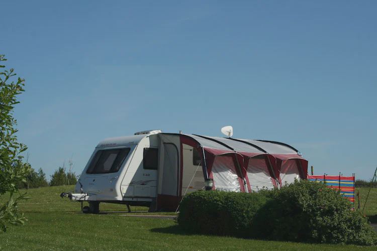Caravan with awning on grass