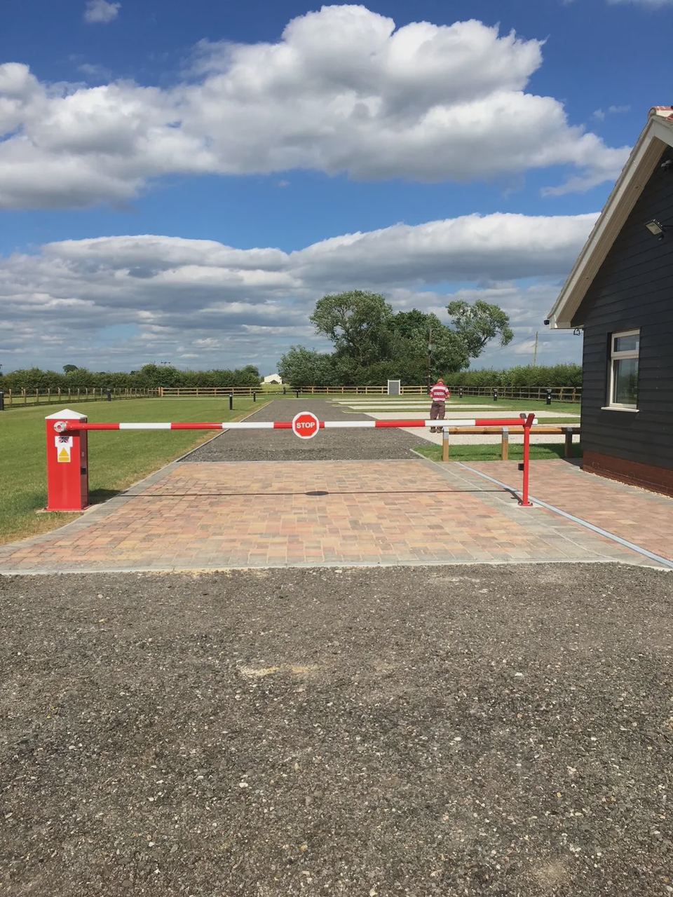 Entrance barrier and drive