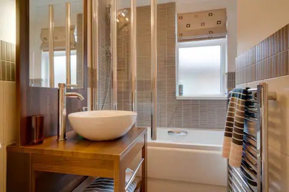 Bathroom with bath and shower