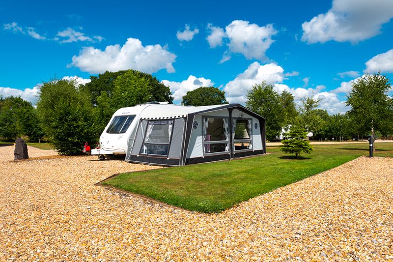 Caravan with awning on gravel
