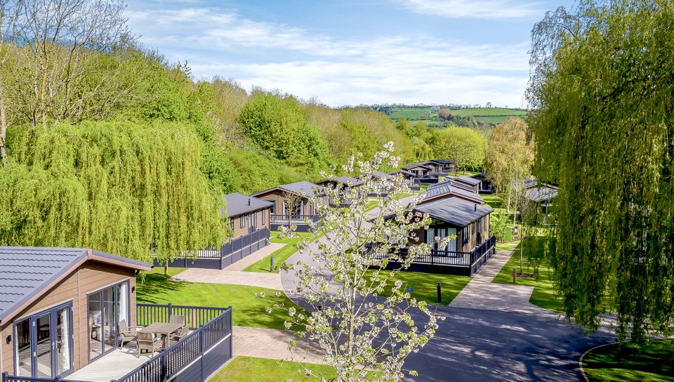 Lodges among trees and lawns