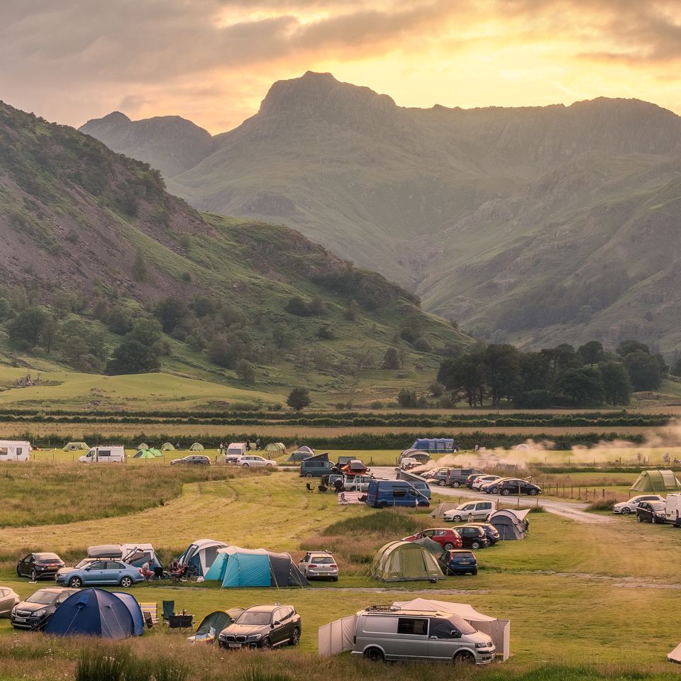 Tents and cars on the grass field