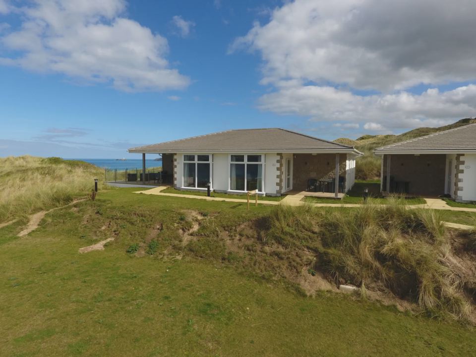 Lodges on the grassy headland
