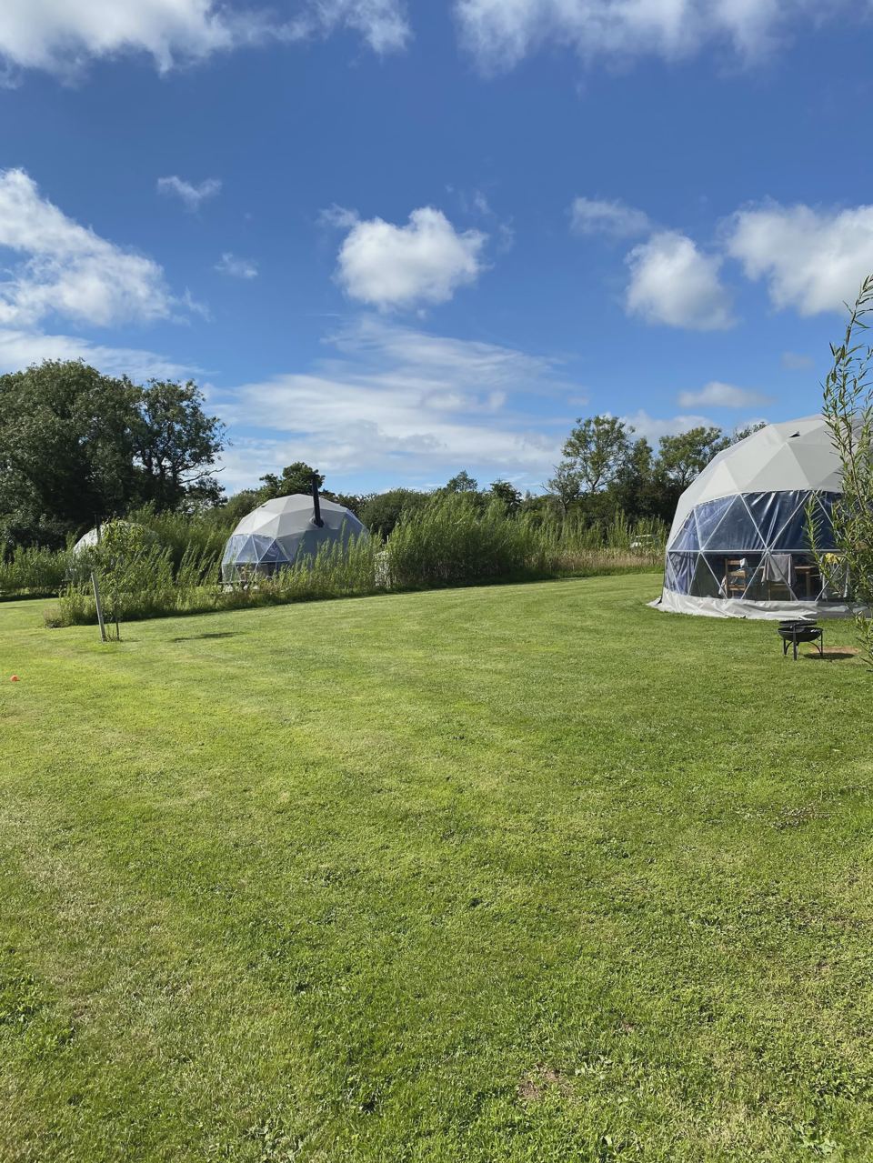 Domes spaced across the grass