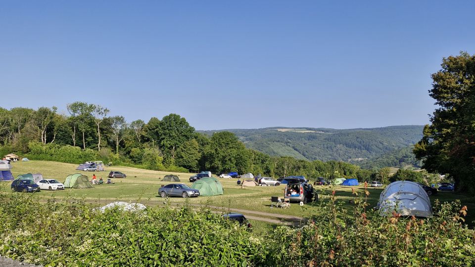 Camping field above the valley