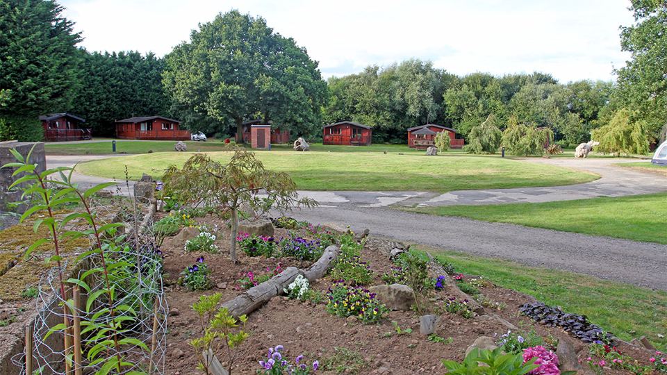 Cabins around a grassy loop