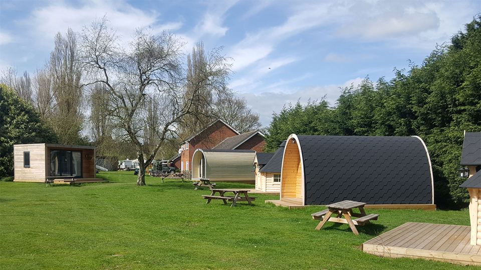 Glamping pods and picnic tables