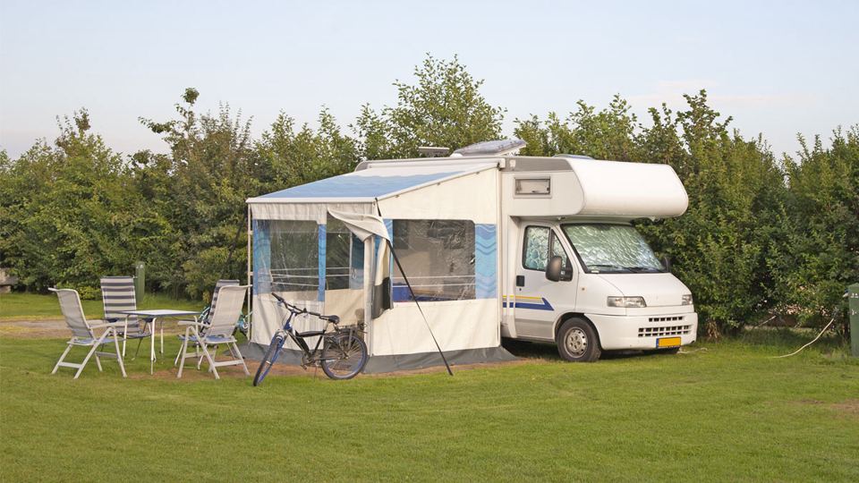 Motorhome with awning on grass