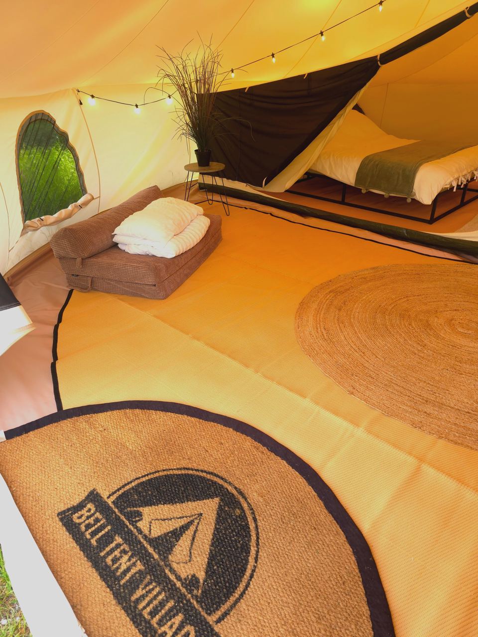 Beds and rug in a tent