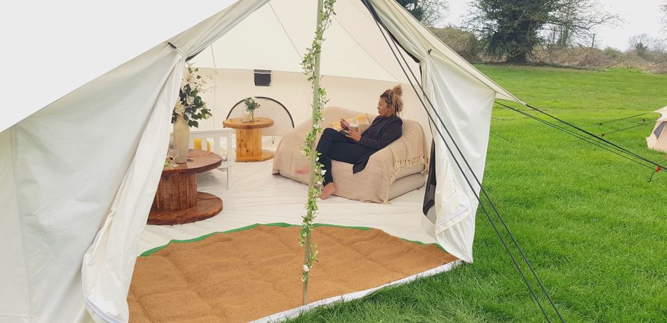 Bell tent open to the lawn
