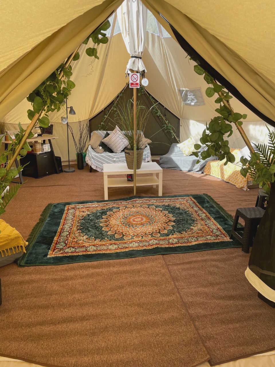 Bell tent interior with rug