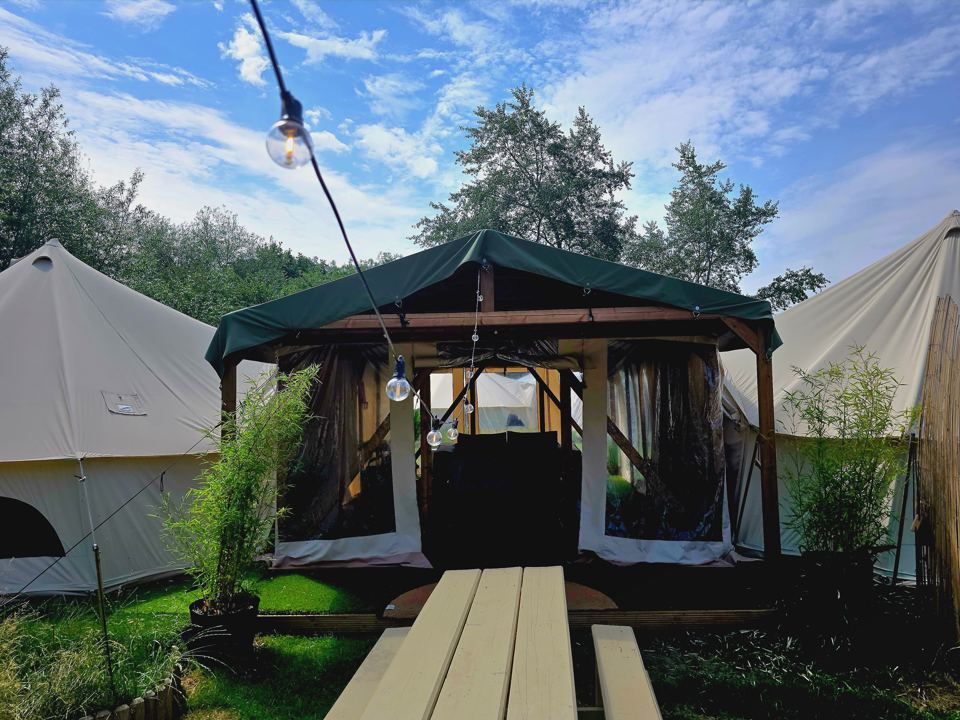 Covered communal area between tents