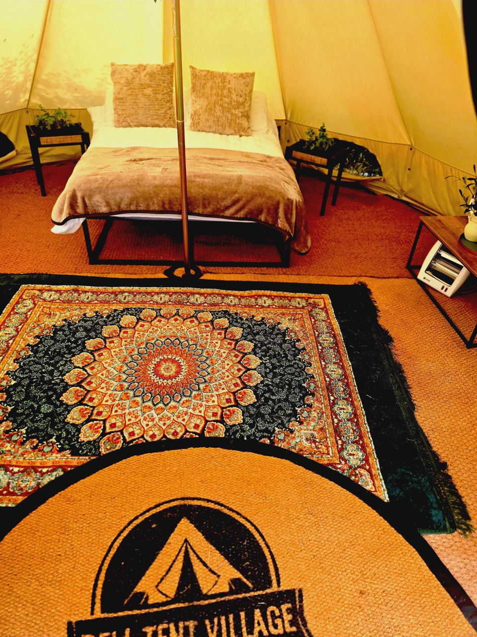 Bed inside a bell tent