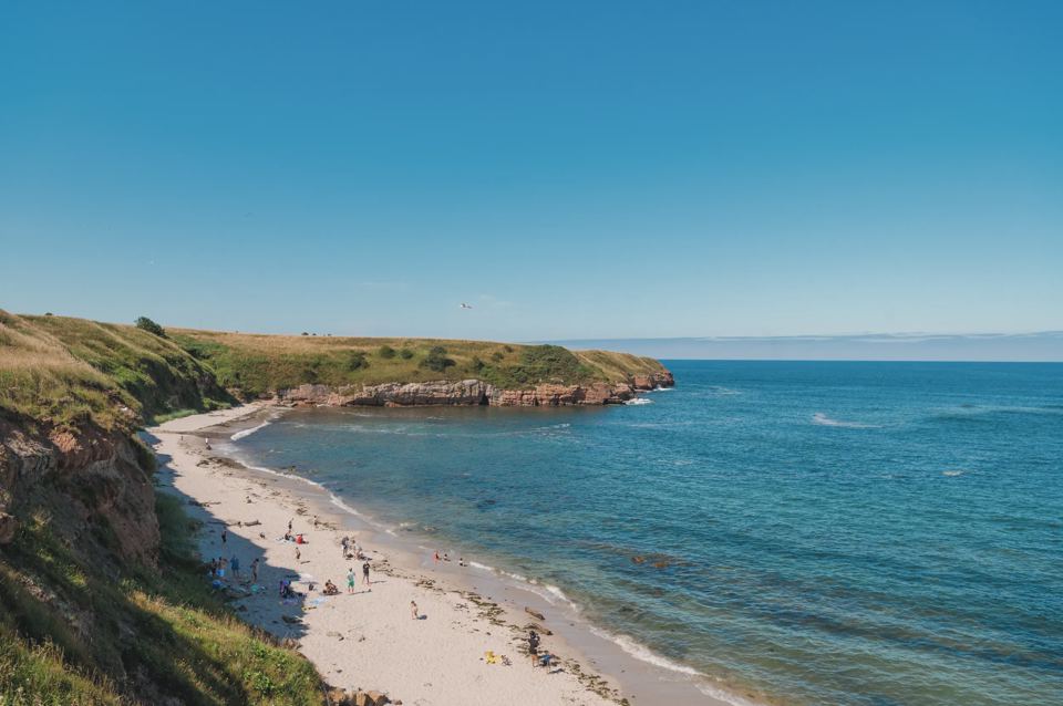 Sandy beach below the cliffs