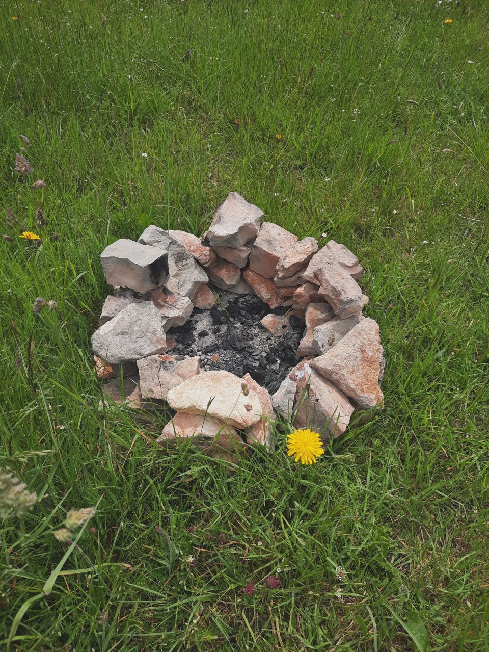 Fire ring among the pitches