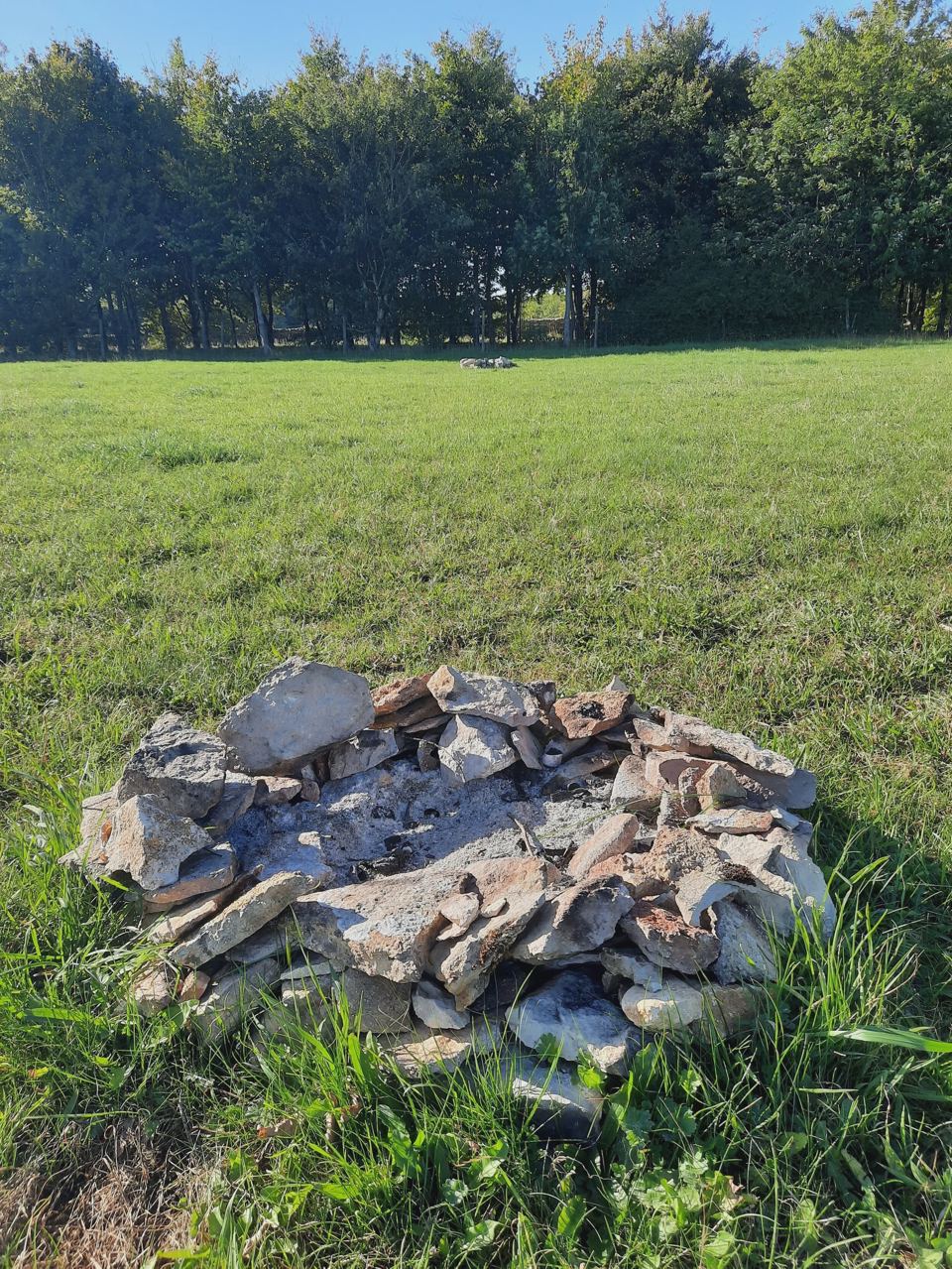 Stone fire ring on the grass