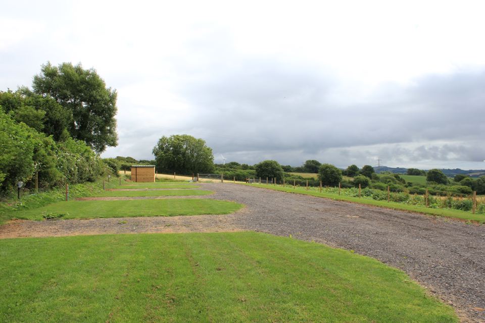 Gravel hardstanding with grass awning strips