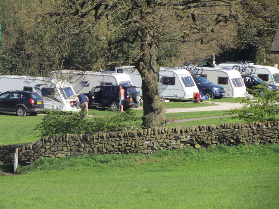 Caravans by the stone wall