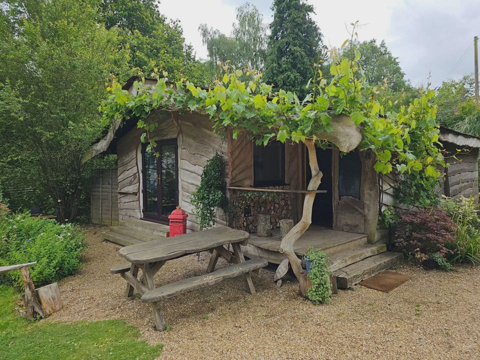 Wooden cabin with picnic bench