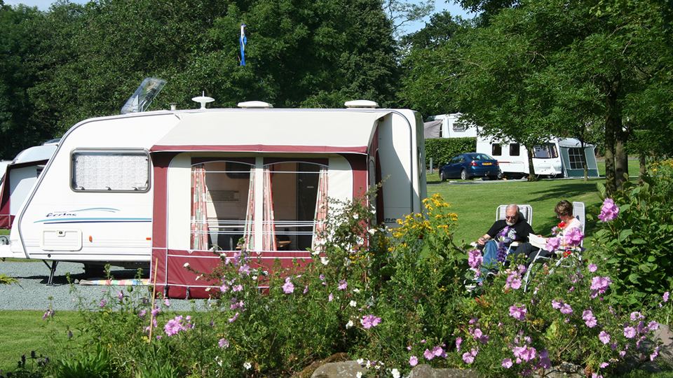Caravan and awning with flowers