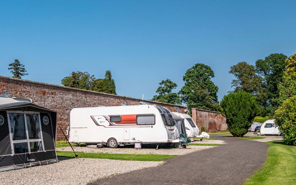 Caravan pitches beside the walled garden