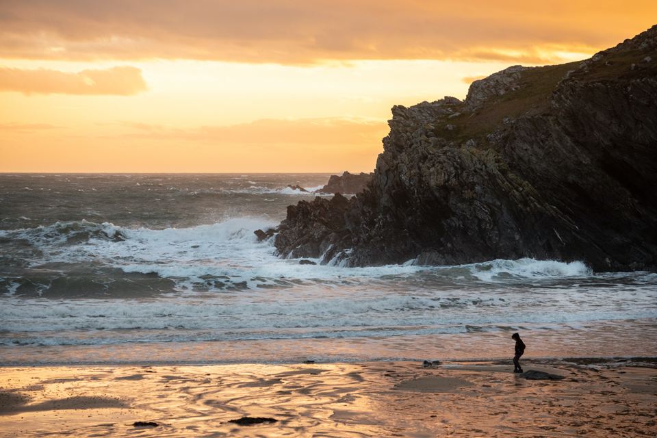 Waves and rocks at sunset