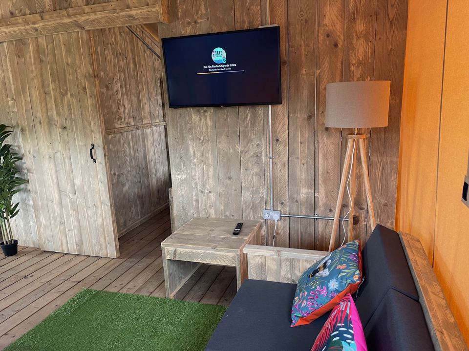 Sofa and TV inside the tent