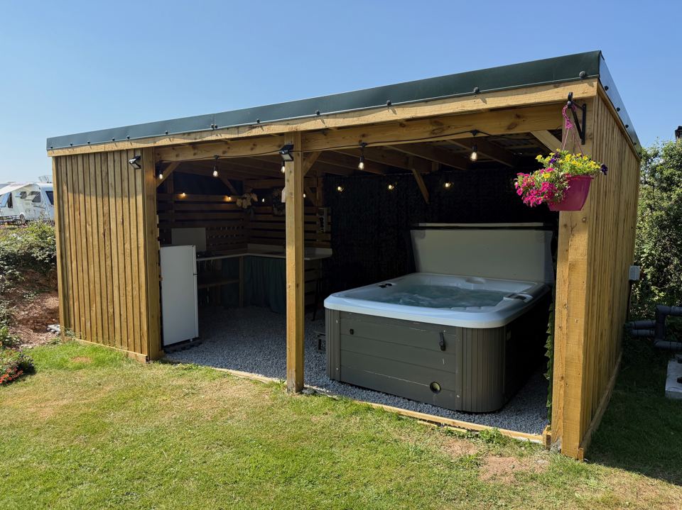Hot tub under a covered shelter