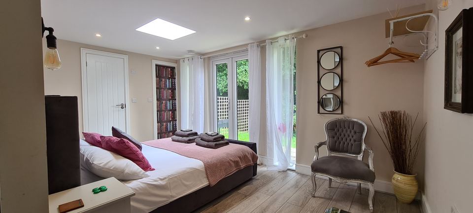Lodge bedroom with garden doors